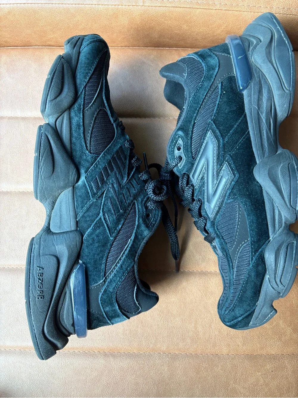 New Balance 9060 sneakers in a Triple Black colorway